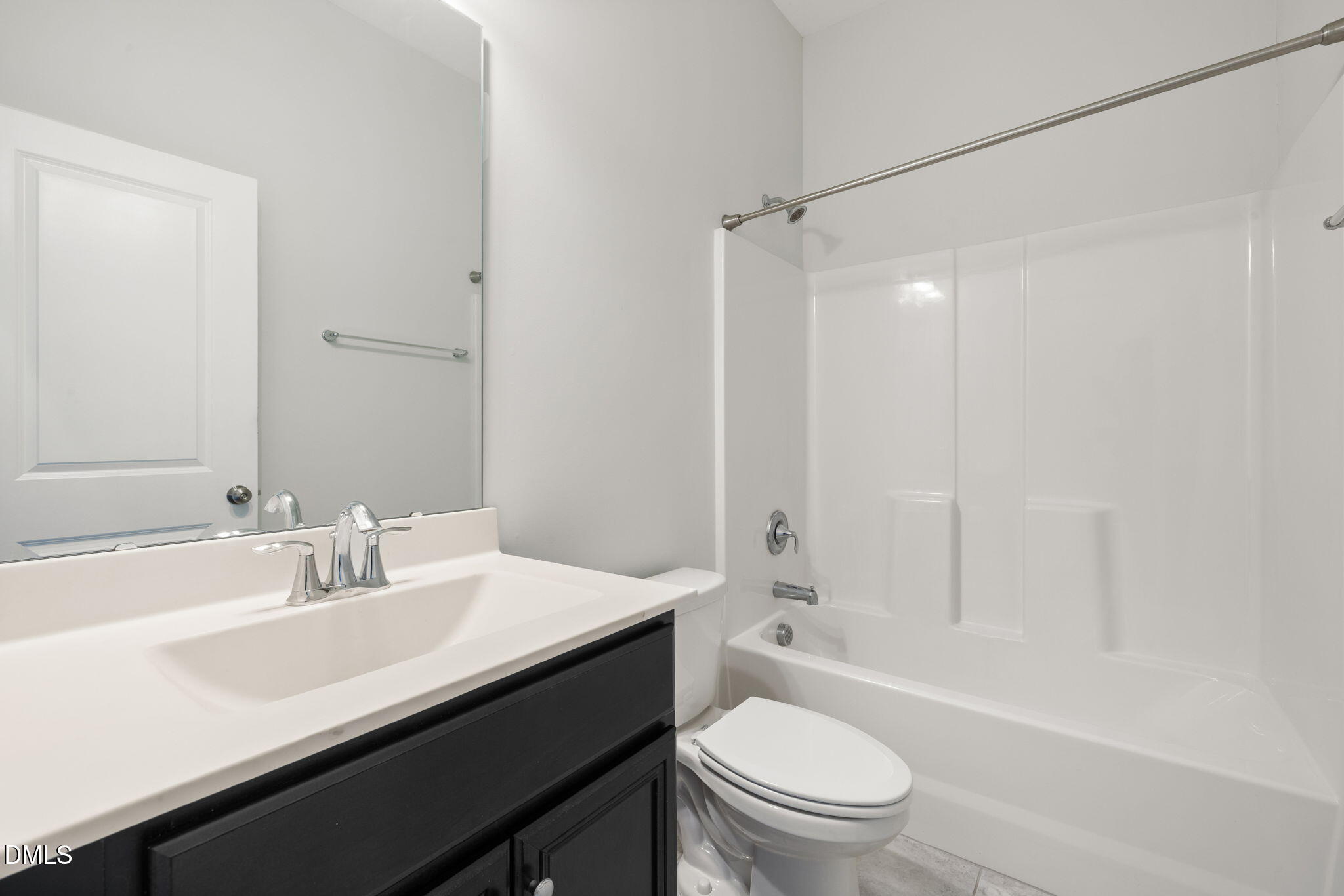 3422 Longleaf Estates Drive Raleigh, NC 27616 - Photo 51 of 71 a bathroom with a sink a toilet and shower