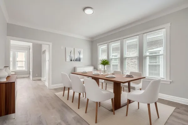 a view of a dining room with furniture and window