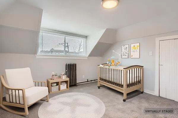 a bedroom with furniture and a window