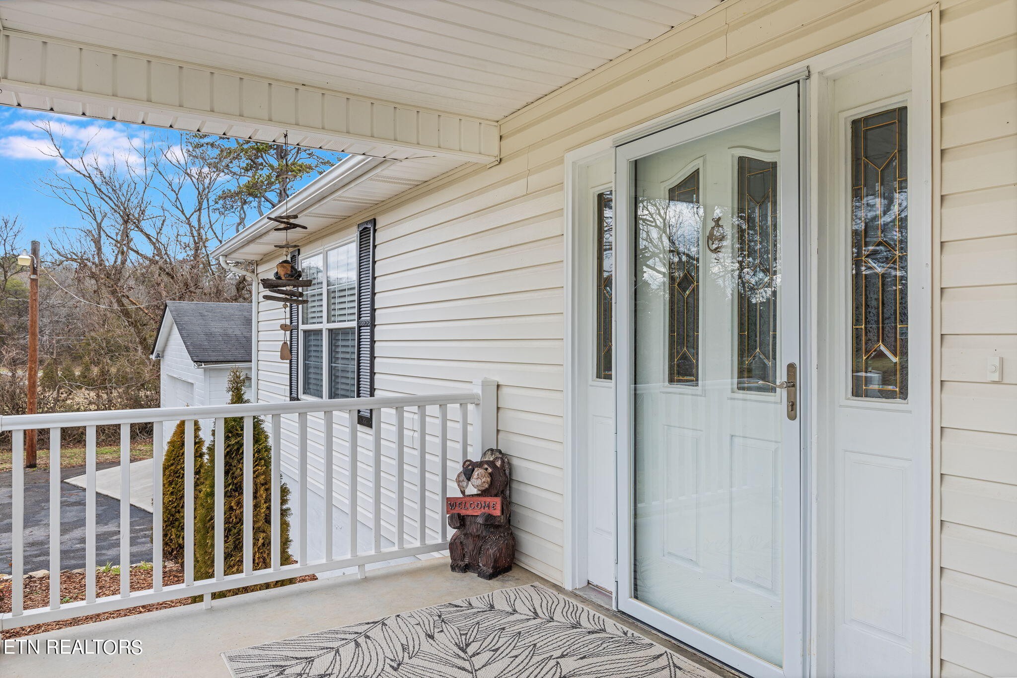 5316 Shipe Road Corryton, TN 37721 - Photo 8 of 36 a view of a porch with a table and chairs
