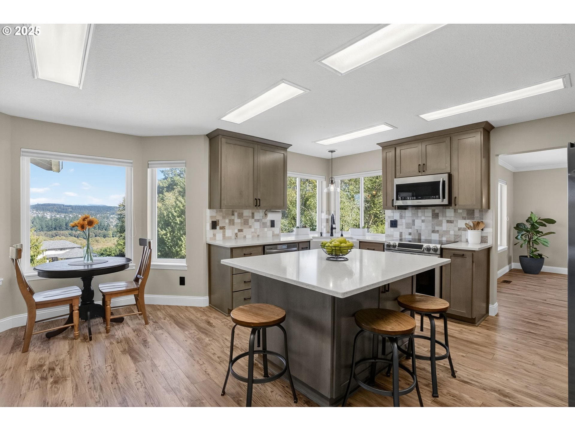 32102 Northwest Eagle Crest Drive Ridgefield, WA 98642 - Photo 11 of 48 a kitchen with a table and chairs in it