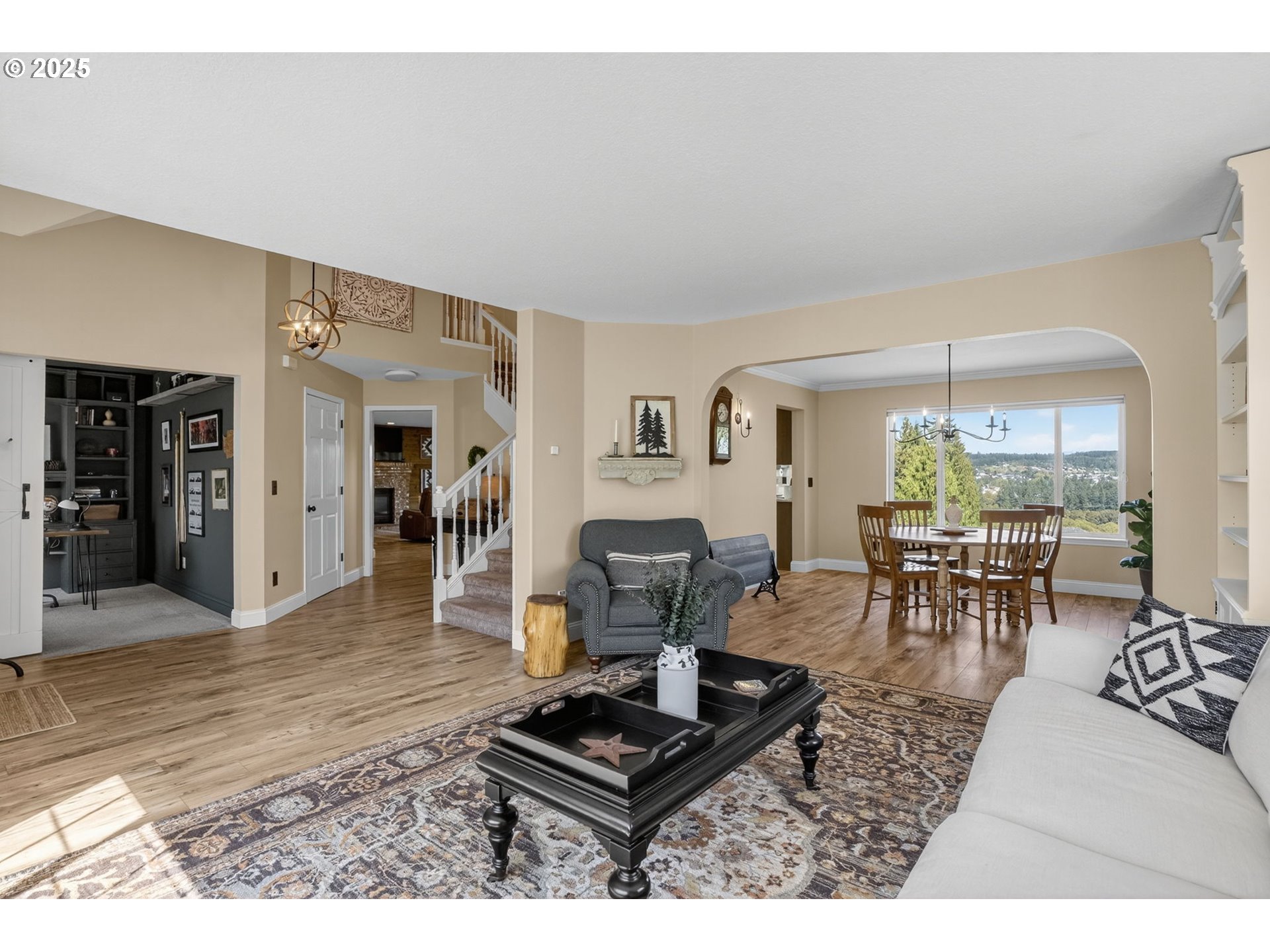 32102 Northwest Eagle Crest Drive Ridgefield, WA 98642 - Photo 14 of 48 a living room with furniture and wooden floor