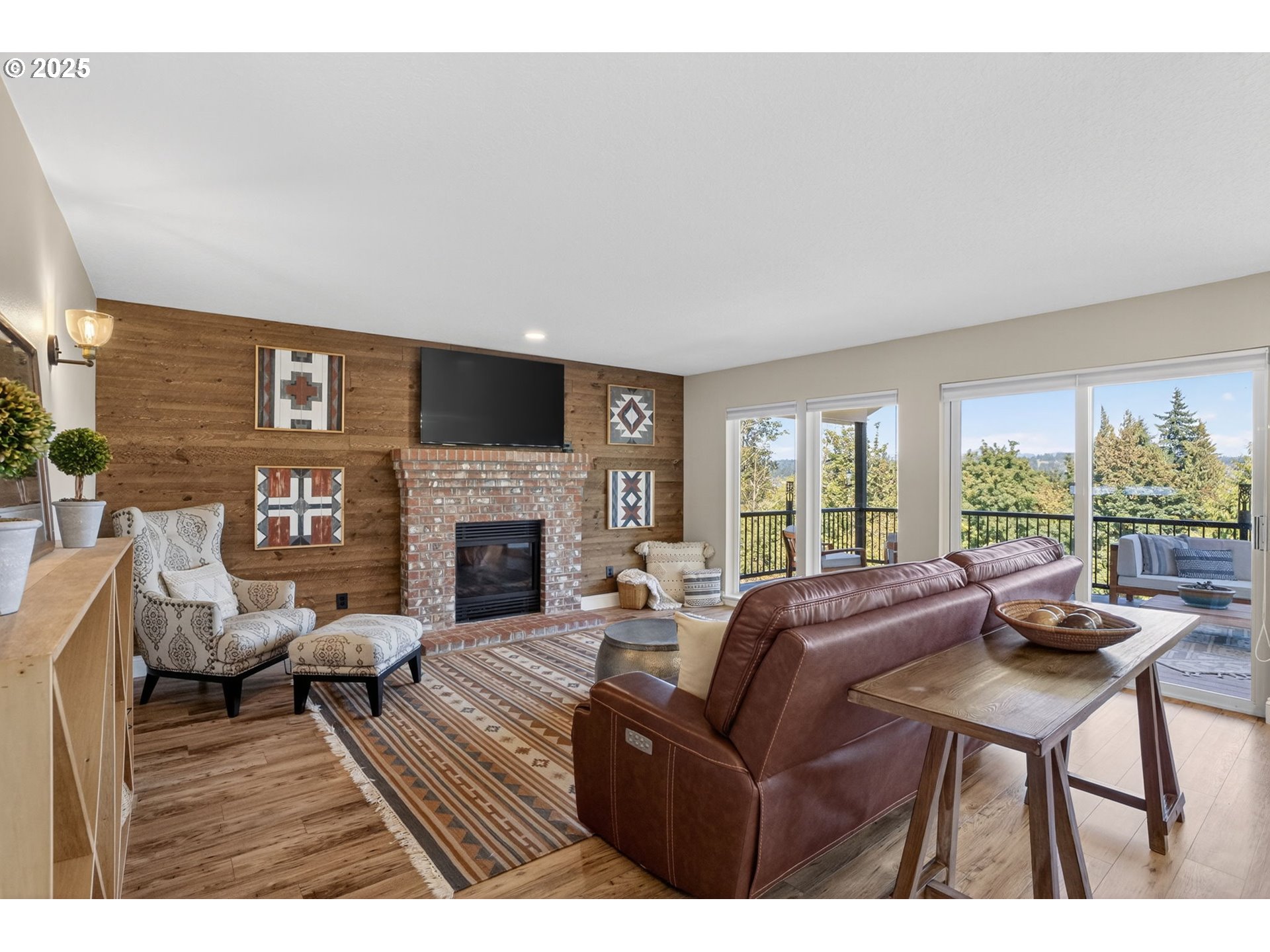 32102 Northwest Eagle Crest Drive Ridgefield, WA 98642 - Photo 17 of 48 a living room with furniture large window and a fireplace