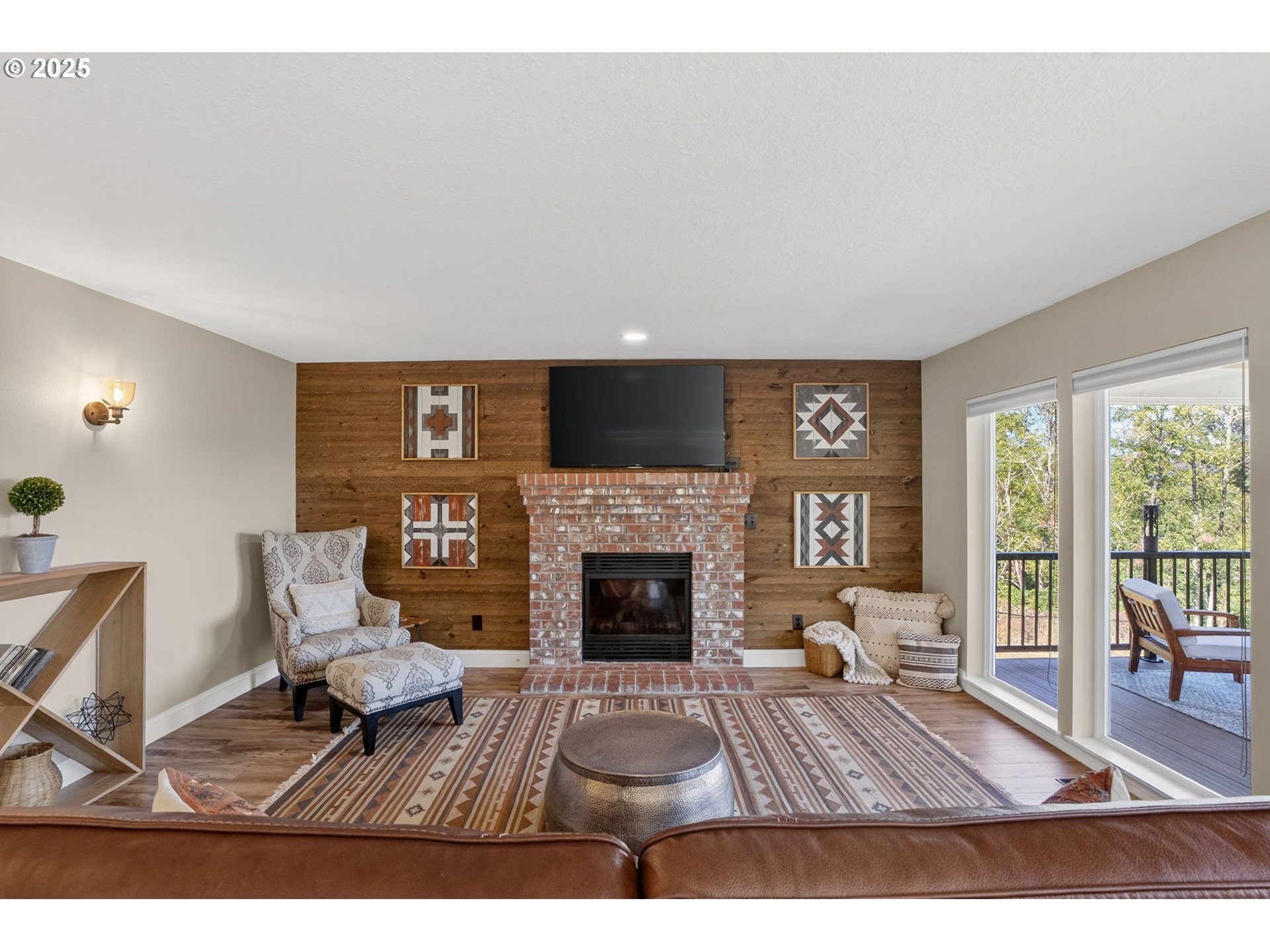 32102 Northwest Eagle Crest Drive Ridgefield, WA 98642 - Photo 18 of 48 a living room with furniture and a fireplace