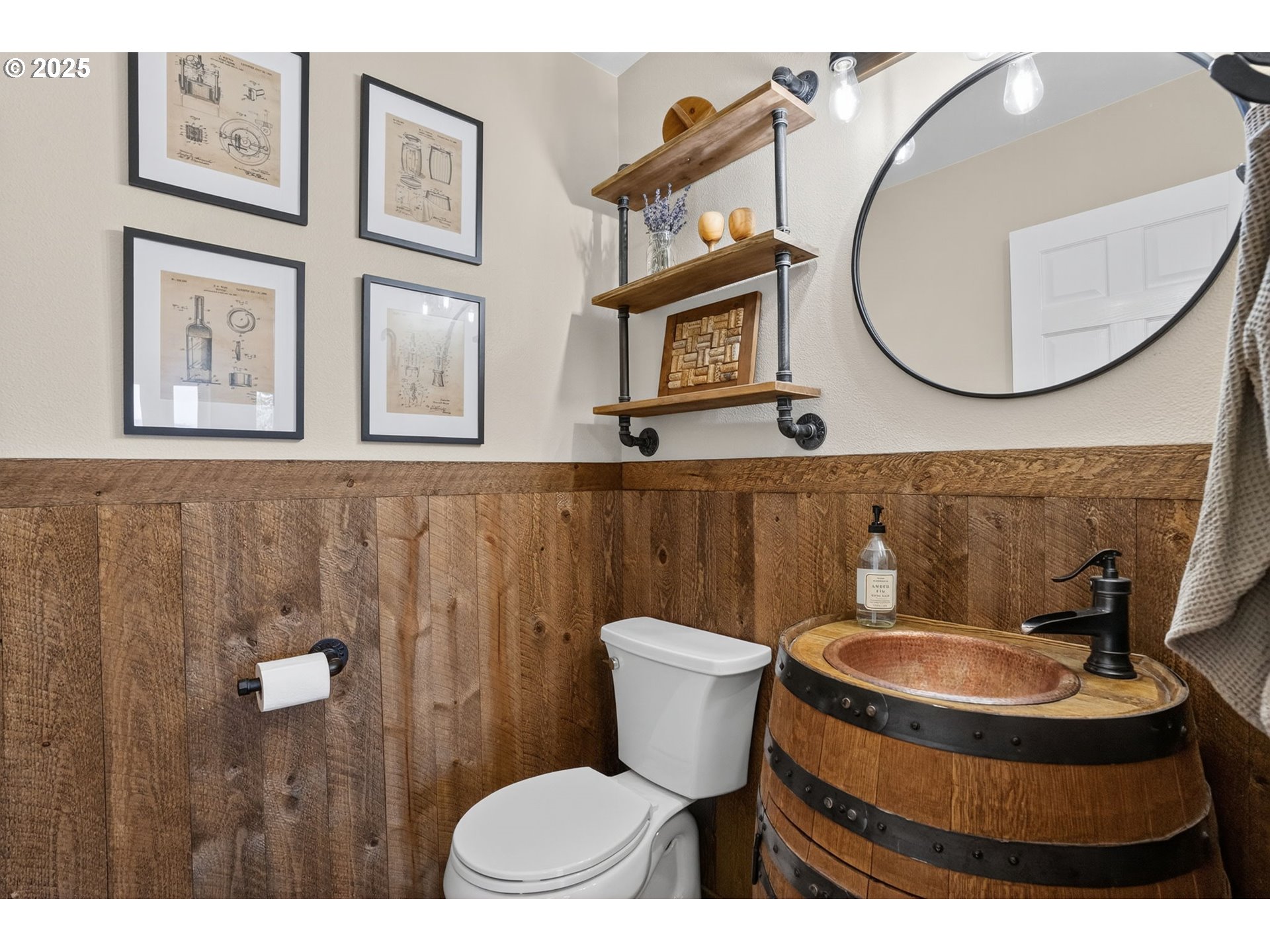 32102 Northwest Eagle Crest Drive Ridgefield, WA 98642 - Photo 20 of 48 a bathroom with a toilet a sink and mirror