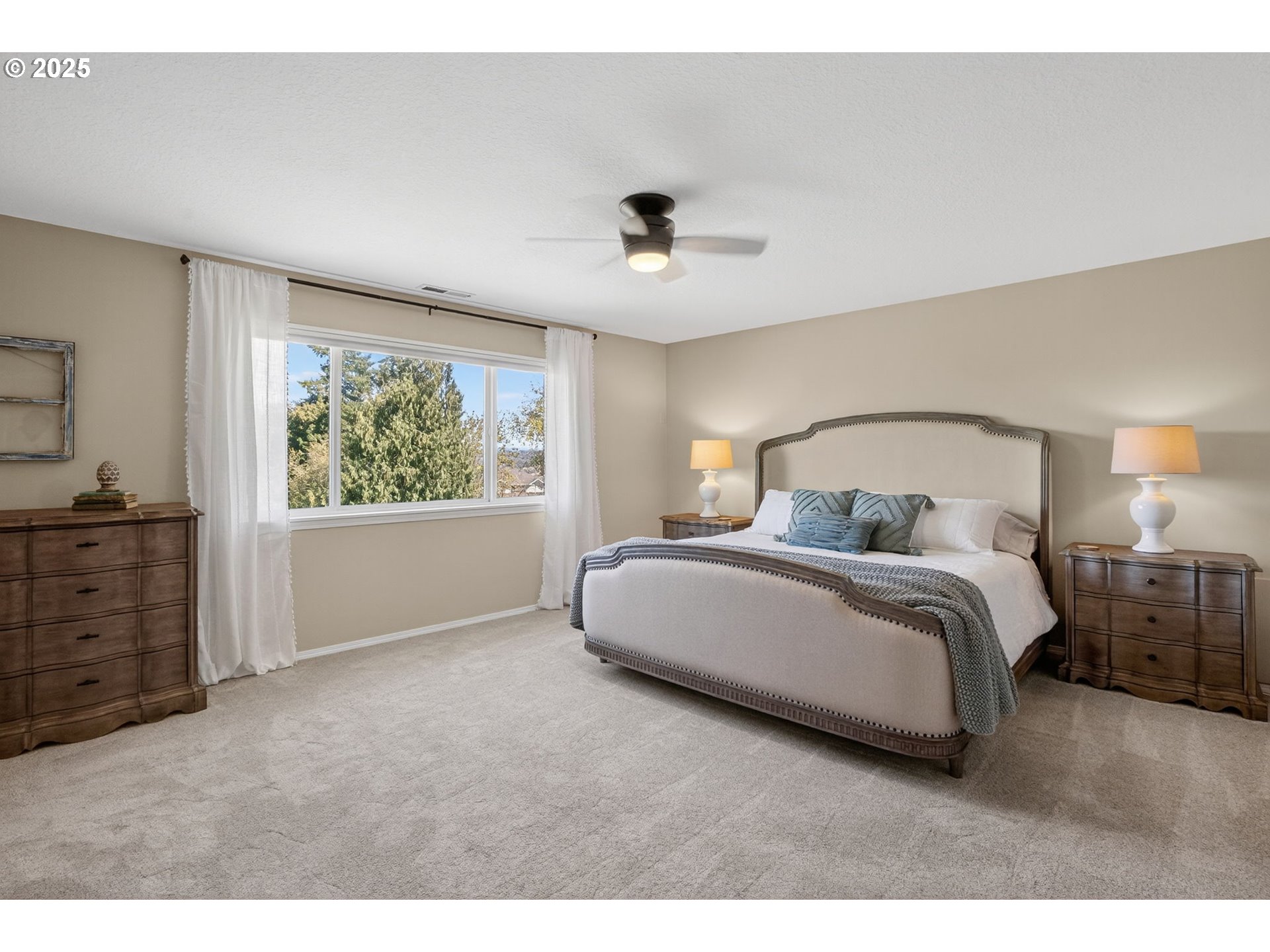 32102 Northwest Eagle Crest Drive Ridgefield, WA 98642 - Photo 21 of 48 a bedroom with a large bed and a window