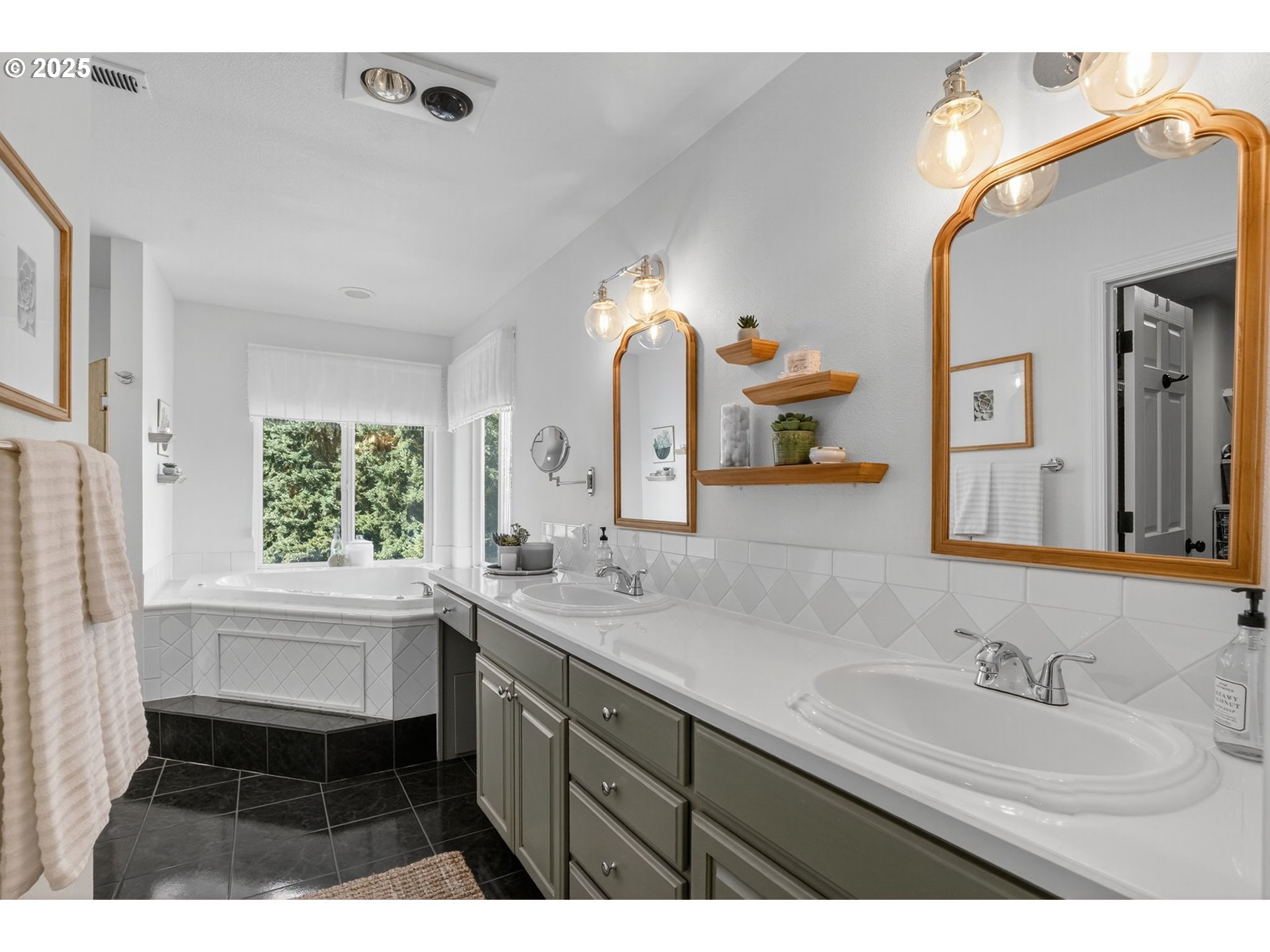 32102 Northwest Eagle Crest Drive Ridgefield, WA 98642 - Photo 23 of 48 a bathroom with a sink double vanity granite and a mirror