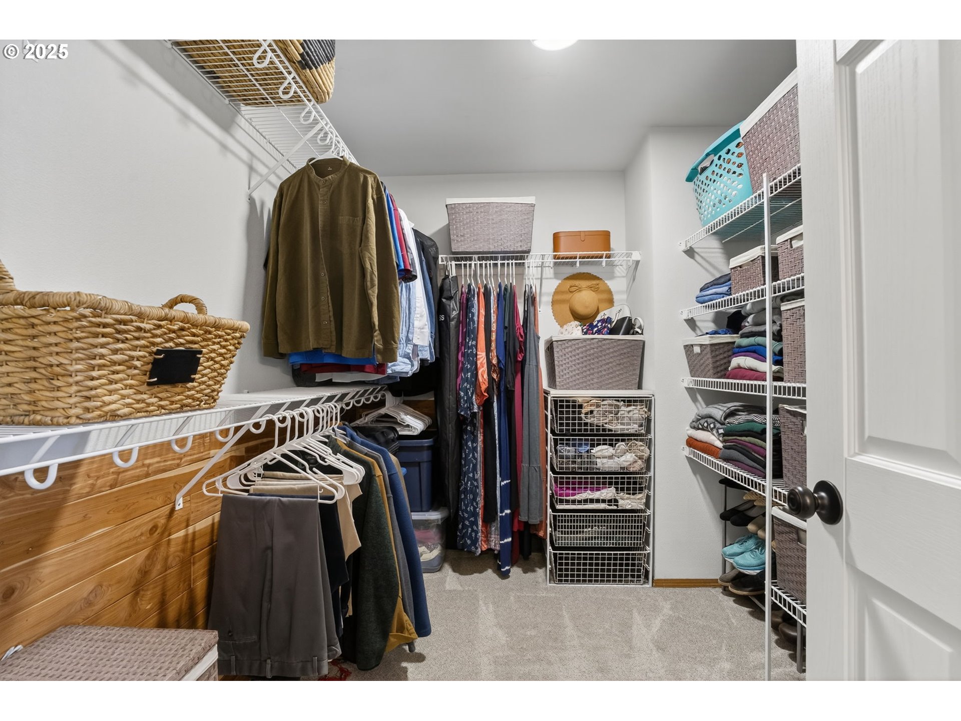 32102 Northwest Eagle Crest Drive Ridgefield, WA 98642 - Photo 26 of 48 a view of walk in closet with clothes and shoes