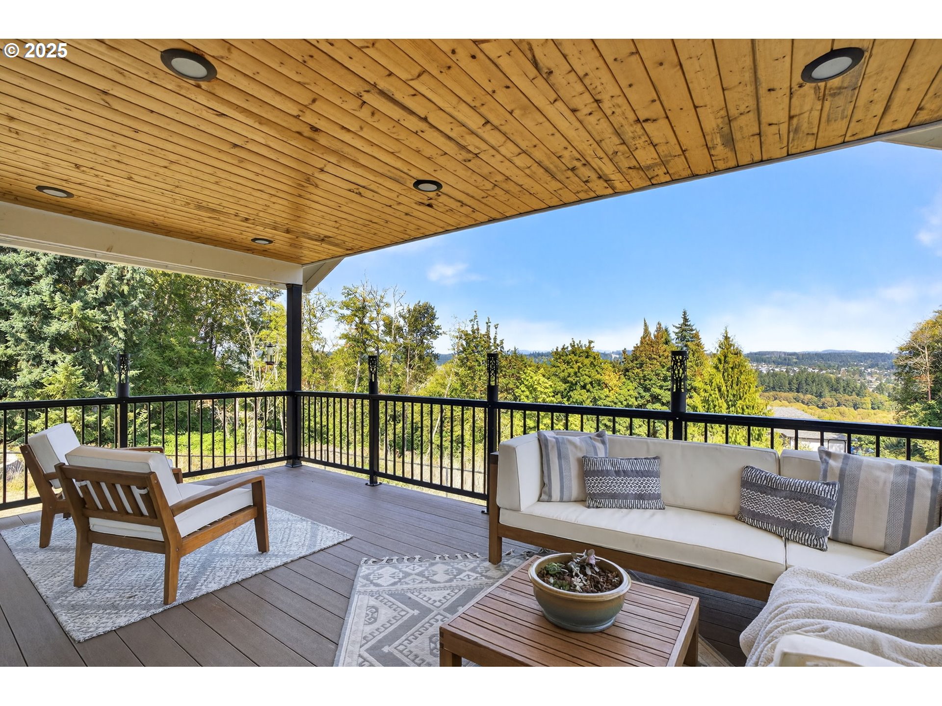 32102 Northwest Eagle Crest Drive Ridgefield, WA 98642 - Photo 29 of 48 a view of a balcony with lake view and wooden floor