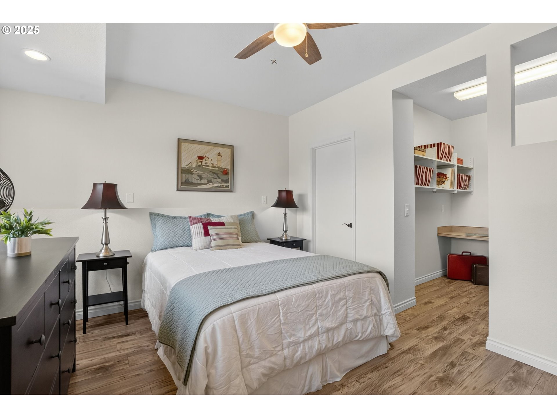 32102 Northwest Eagle Crest Drive Ridgefield, WA 98642 - Photo 35 of 48 a bedroom with a bed and a chandelier