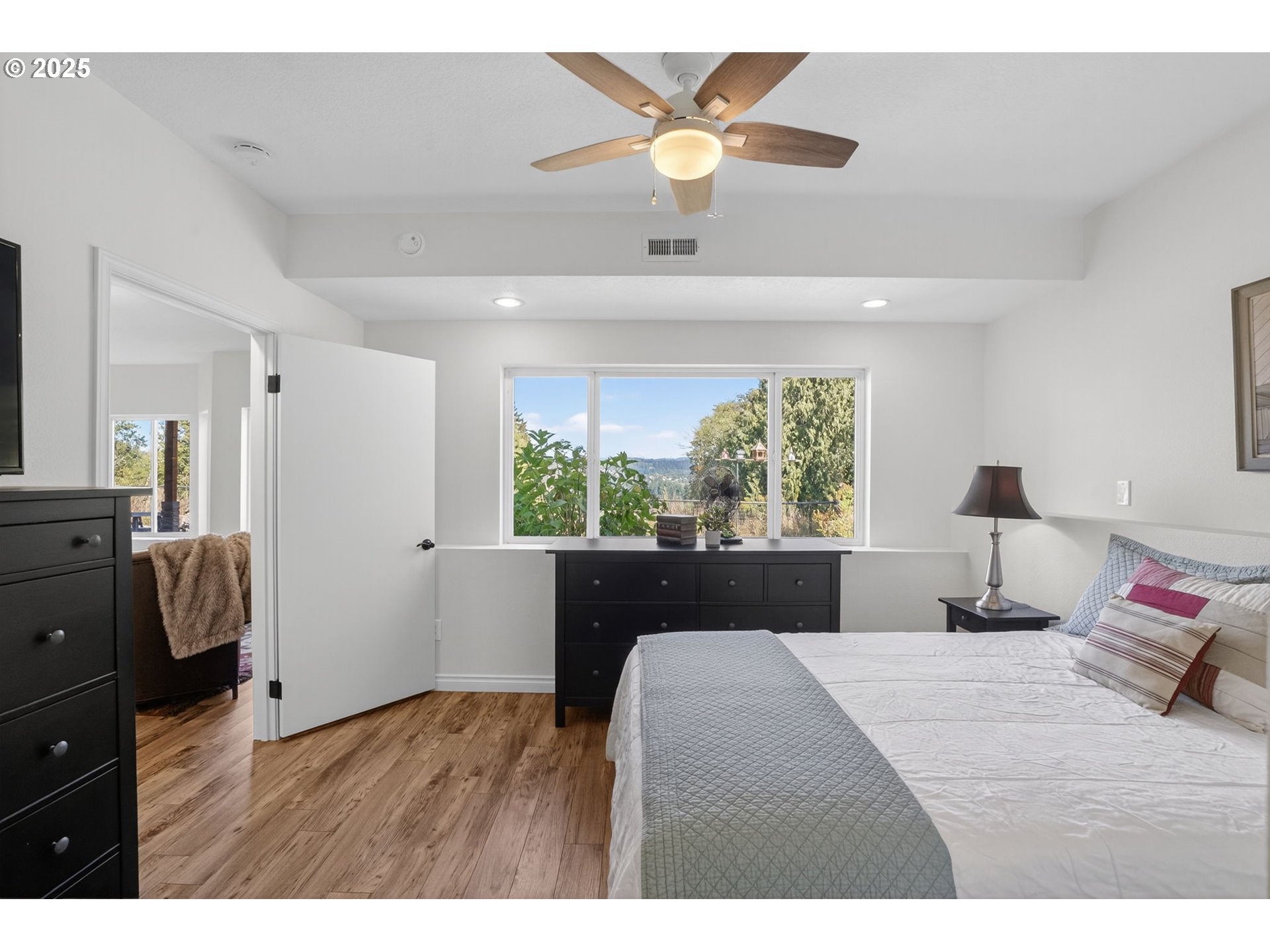 32102 Northwest Eagle Crest Drive Ridgefield, WA 98642 - Photo 36 of 48 a bedroom with a large bed and a window
