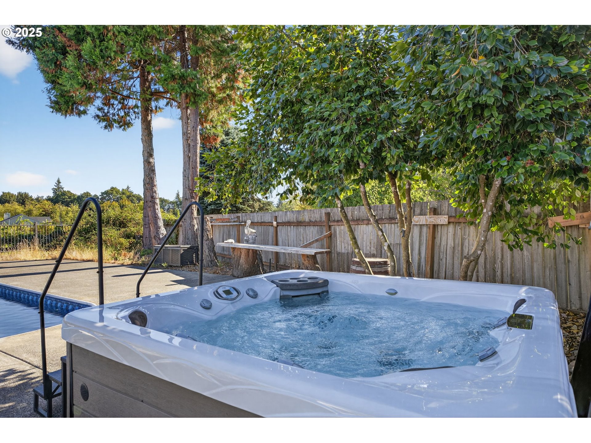 32102 Northwest Eagle Crest Drive Ridgefield, WA 98642 - Photo 46 of 48 a view of swimming pool with a patio and lake view