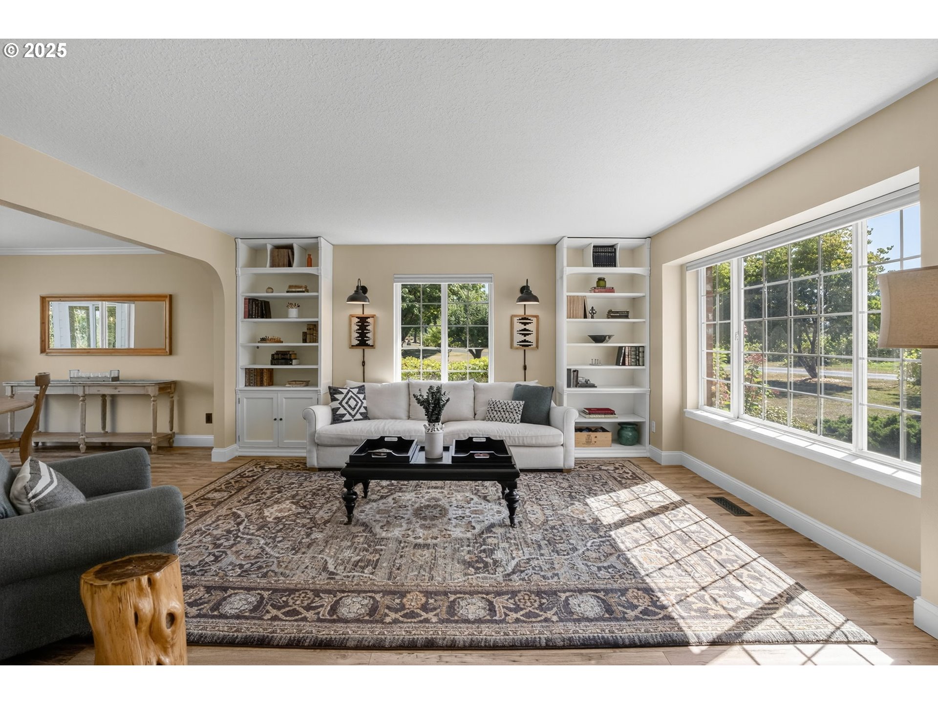 32102 Northwest Eagle Crest Drive Ridgefield, WA 98642 - Photo 8 of 48 a living room with furniture hard wood floor and a floor to ceiling window