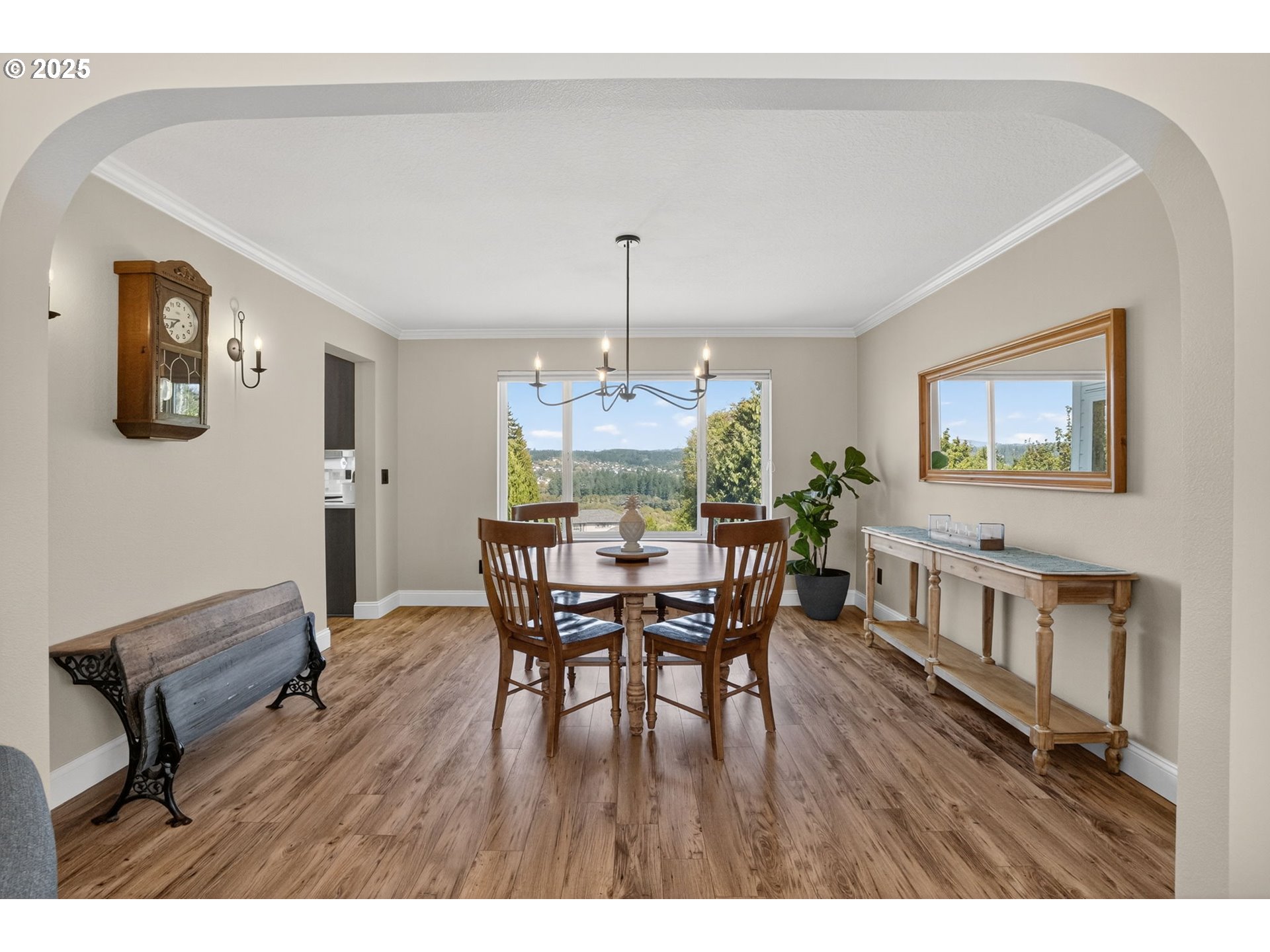 32102 Northwest Eagle Crest Drive Ridgefield, WA 98642 - Photo 9 of 48 a view of a dining room with furniture window and wooden floor