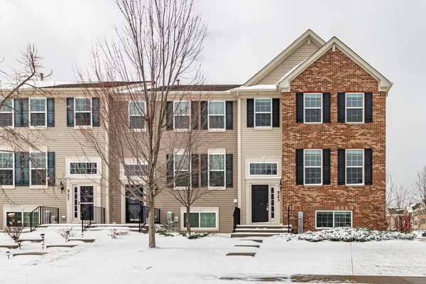 a front view of a house with a yard