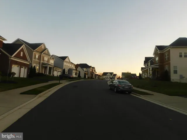 a view of houses with a city street
