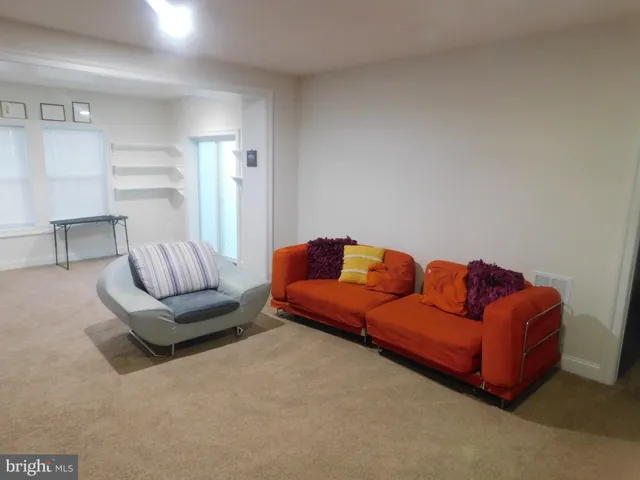 a living room with furniture and a couch