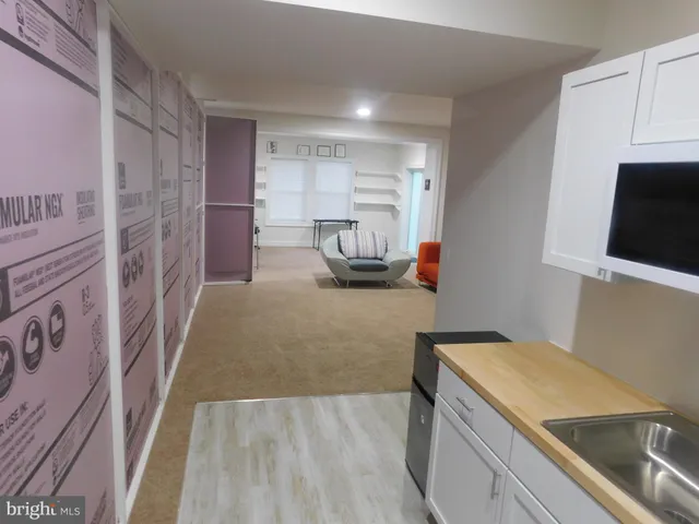 a utility room with sink dryer and washer