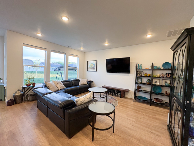 412 West 3025th Street South Logan, UT 84321 - Photo 15 of 34 Living area with light wood-style floors and recessed lighting