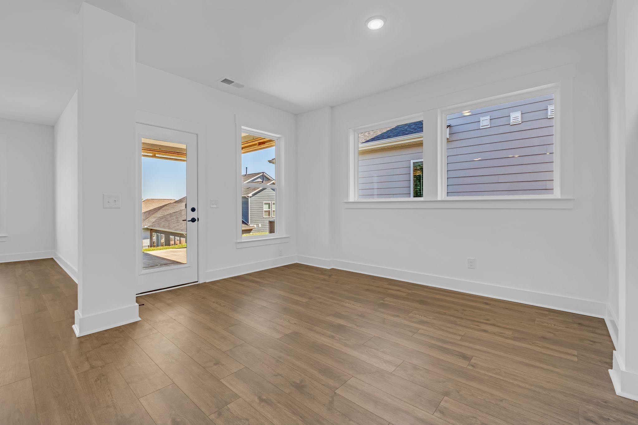 1102 Callaway Drive Lebanon, TN 37087 - Photo 13 of 30 a view of an empty room with wooden floor and a window
