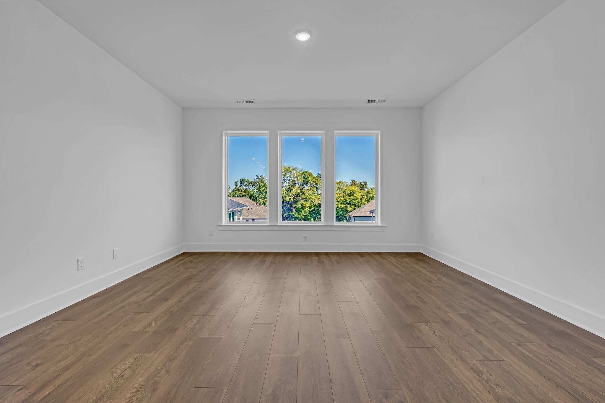 1102 Callaway Drive Lebanon, TN 37087 - Photo 14 of 30 a view of an empty room with wooden floor and a window
