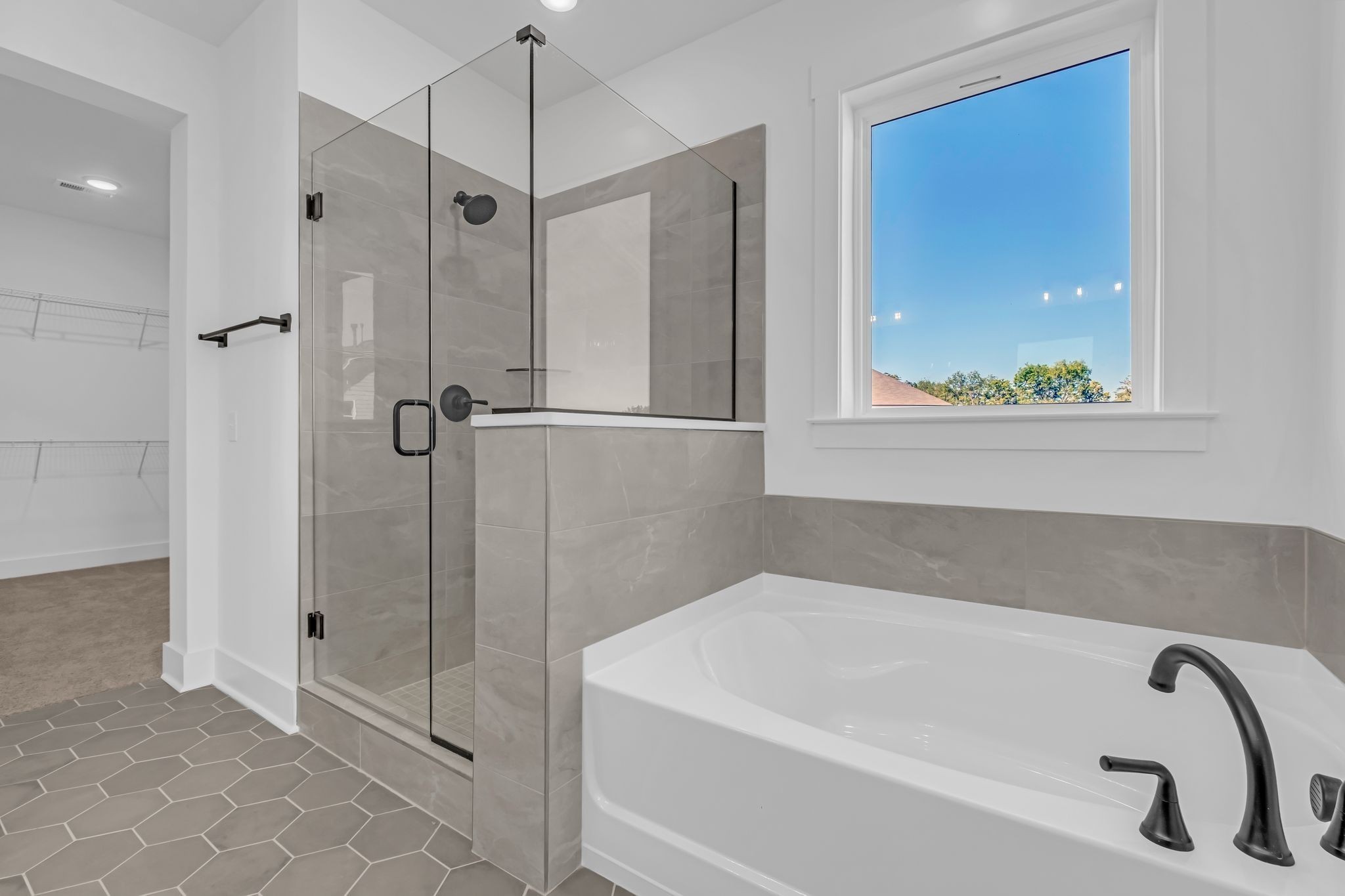 1102 Callaway Drive Lebanon, TN 37087 - Photo 18 of 30 a bathroom with a tub and a shower