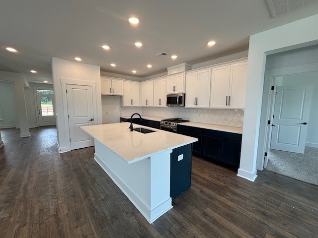 1102 Callaway Drive Lebanon, TN 37087 - Photo 2 of 30 a kitchen with kitchen island a sink dishwasher stove with wooden floors