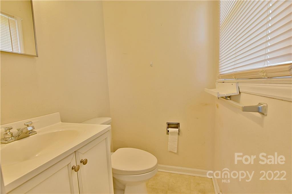 243 Eden Circle Pineville, NC 28134 - Photo 11 of 18 a bathroom with a sink and a toilet