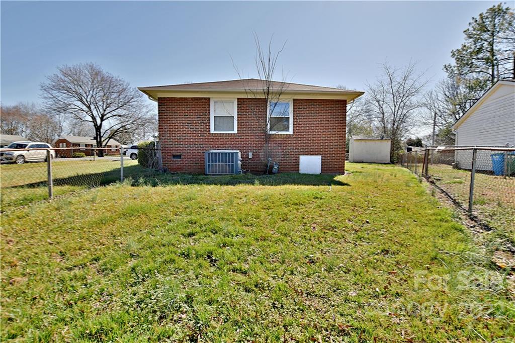 243 Eden Circle Pineville, NC 28134 - Photo 17 of 18 a view of a house with a yard
