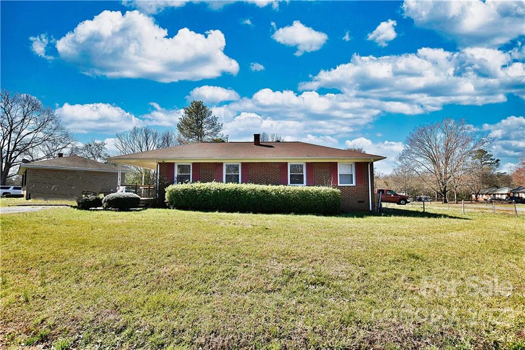 243 Eden Circle Pineville, NC 28134 - Photo 18 of 18 a front view of a house with a yard