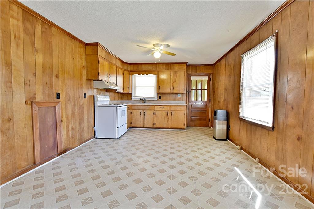243 Eden Circle Pineville, NC 28134 - Photo 8 of 18 a kitchen with stainless steel appliances granite countertop a refrigerator and a stove top oven