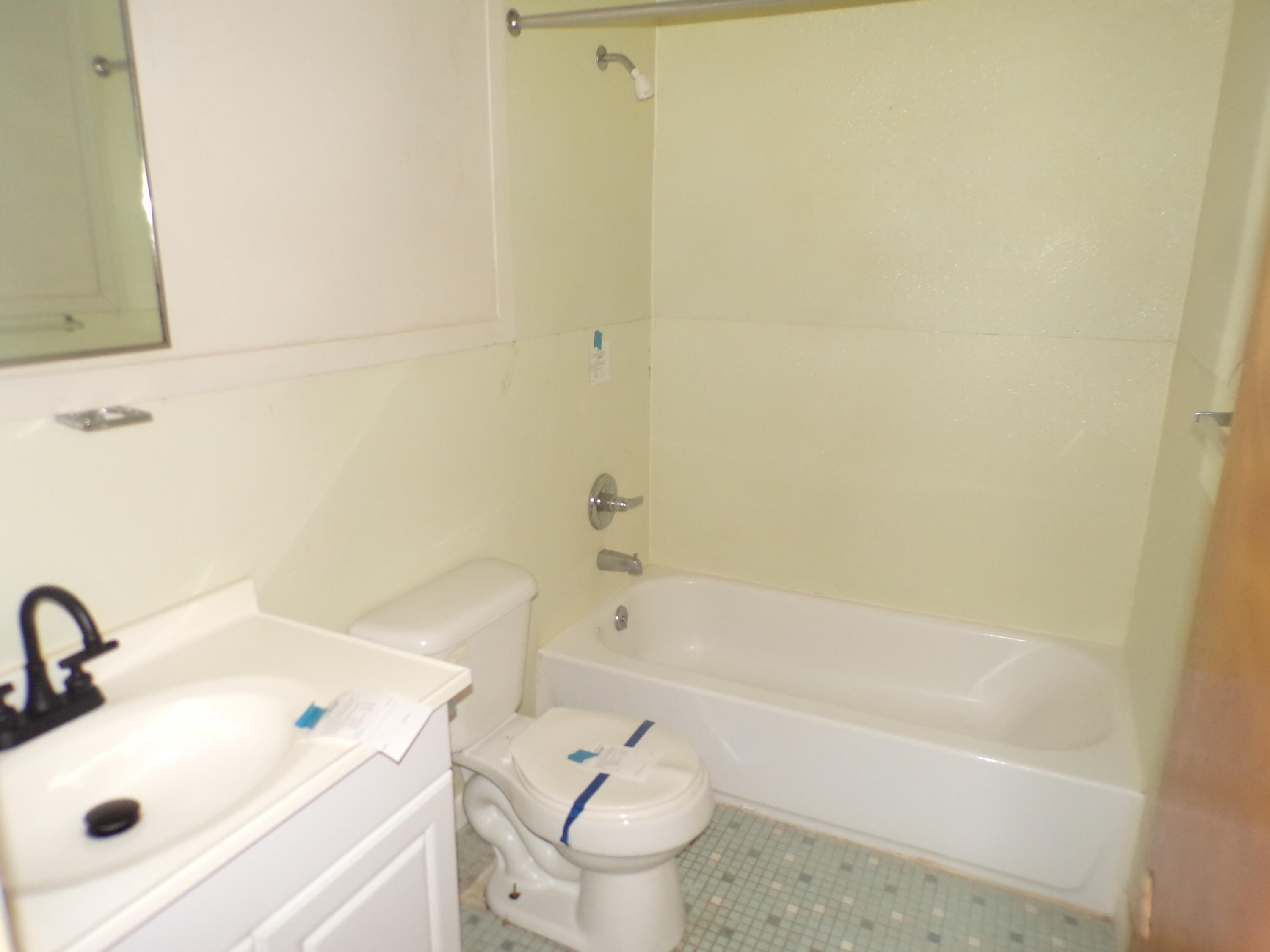 841 Mobley Street Thomson, GA 30824 - Photo 9 of 12 tub/shower combination, ceramic tile floor