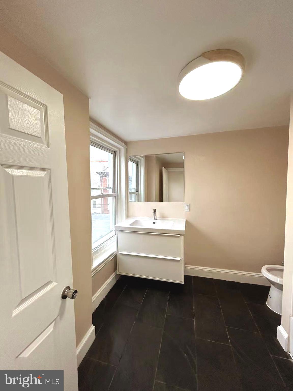 2703 Poplar Street Philadelphia, PA 19130 - Photo 15 of 21 a bathroom with a bathtub and a sink