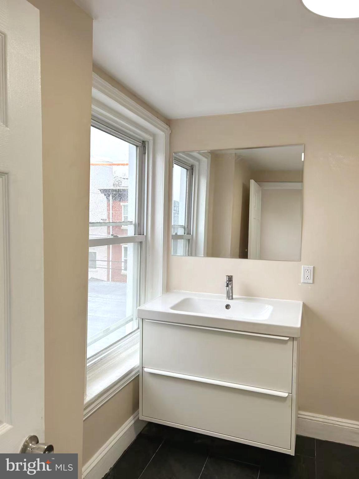 2703 Poplar Street Philadelphia, PA 19130 - Photo 16 of 21 a bathroom with a sink and a bathtub
