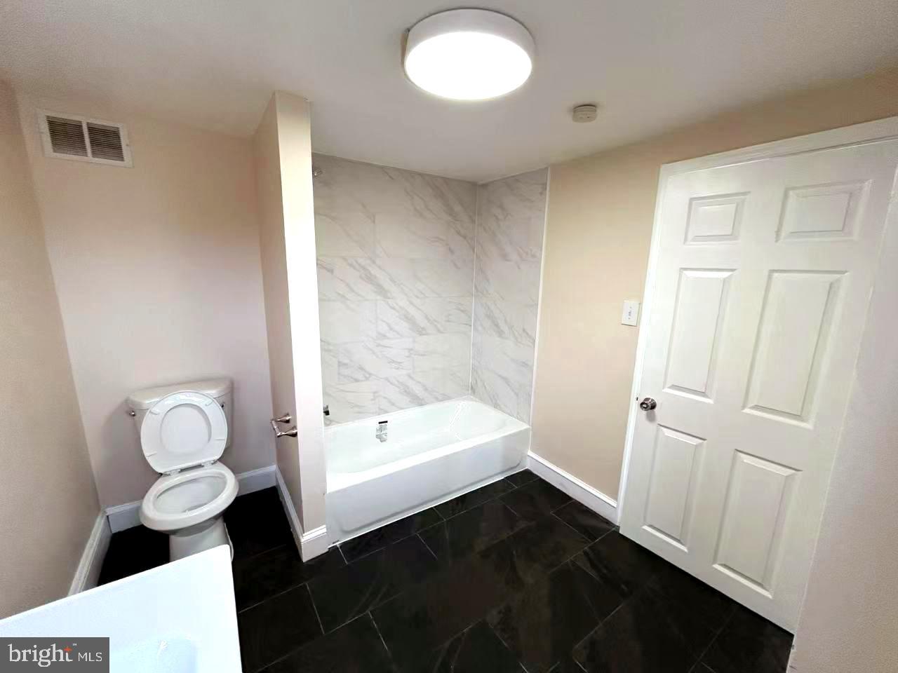 2703 Poplar Street Philadelphia, PA 19130 - Photo 17 of 21 a bathroom with a sink and a mirror