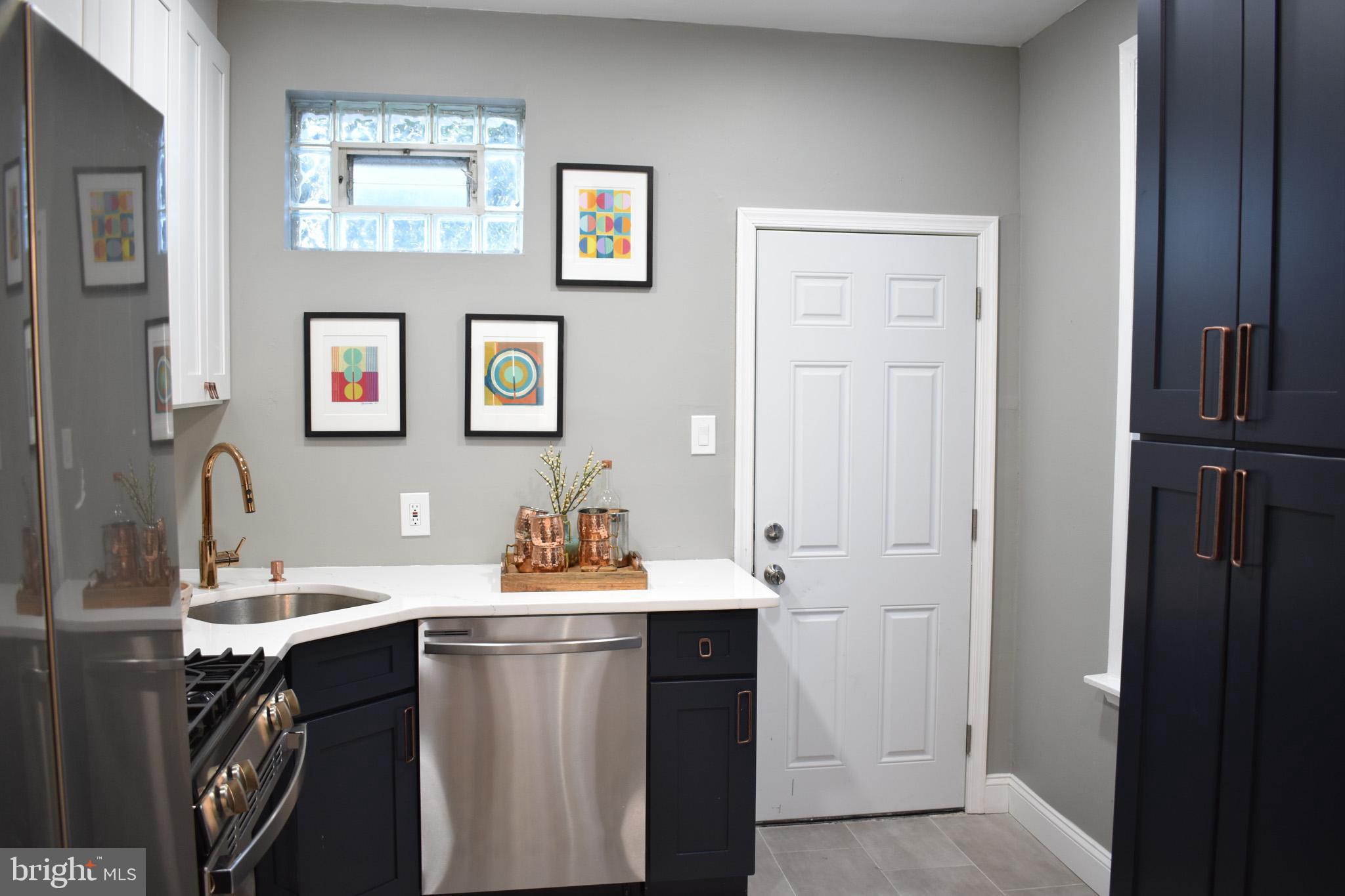 2703 Poplar Street Philadelphia, PA 19130 - Photo 6 of 21 a bathroom with a sink vanity and a mirror