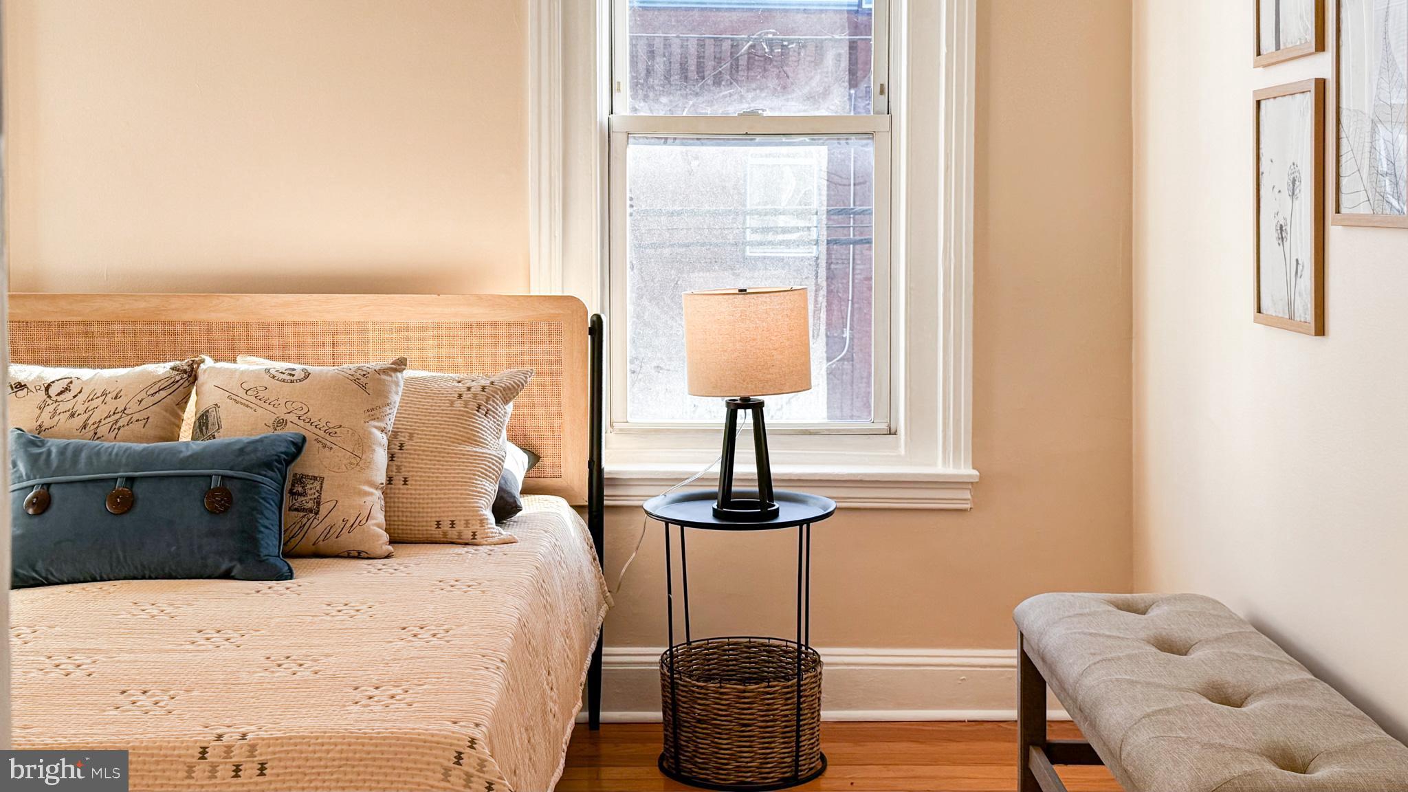 2703 Poplar Street Philadelphia, PA 19130 - Photo 10 of 21 a bedroom with a bed and wooden floor