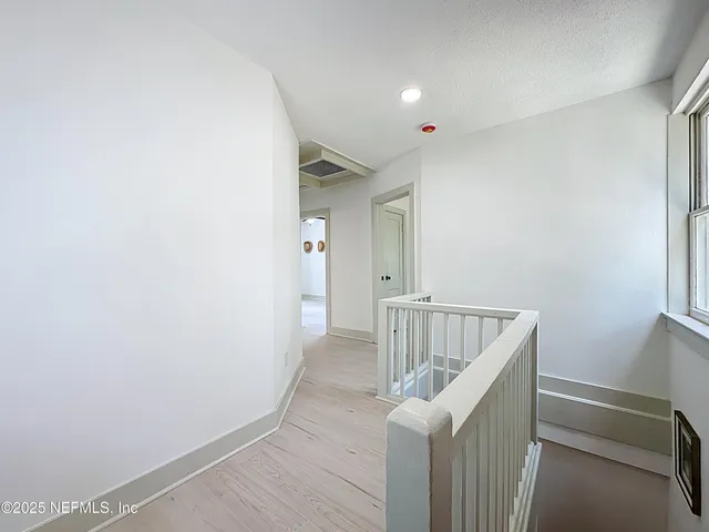 a view of room with wooden floor