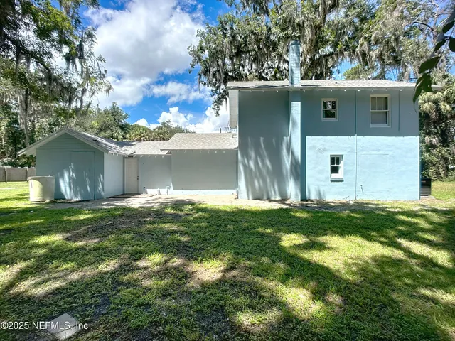 a view of a park with large trees