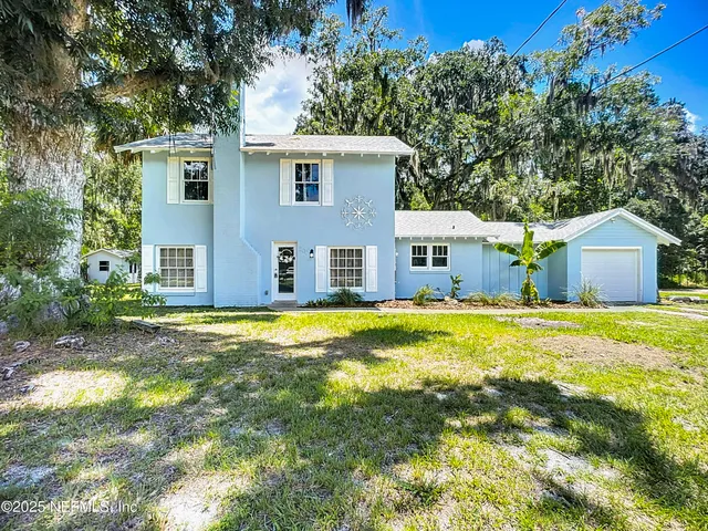 a backyard of a house with lots of green space