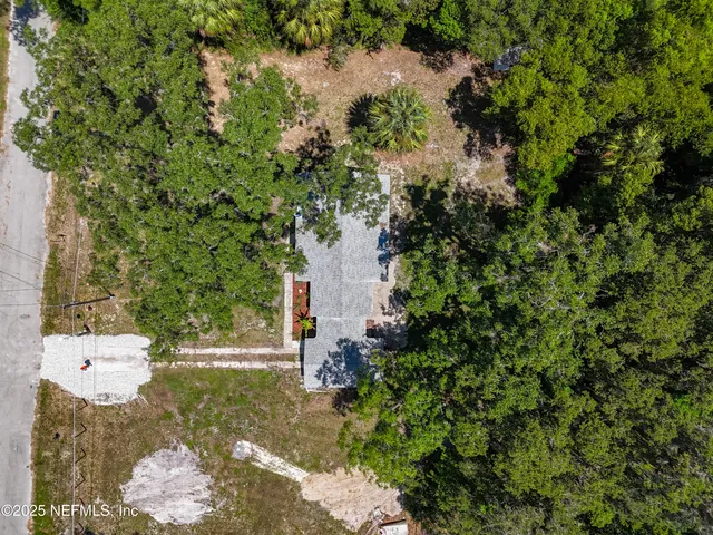 a backyard of a house with lots of green space and mountain view