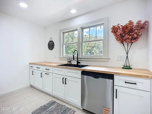 a kitchen with a sink and a window