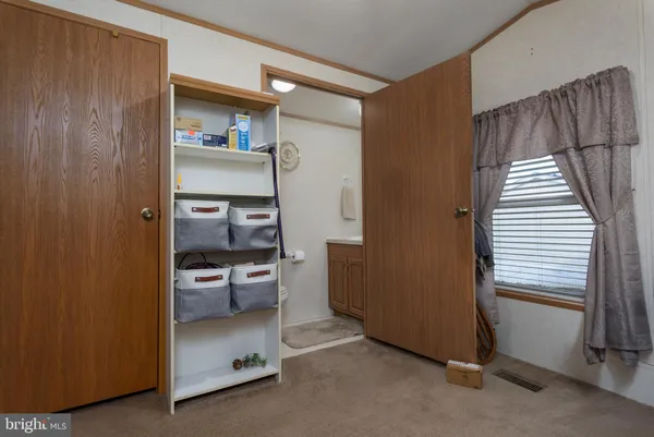 a bedroom with furniture and a gym machine
