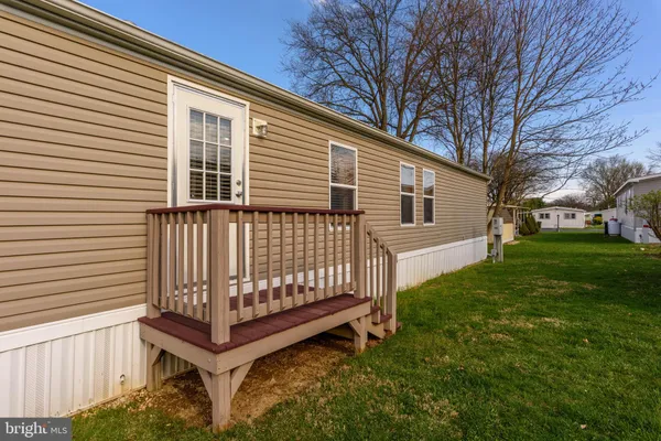 a view of backyard with a deck