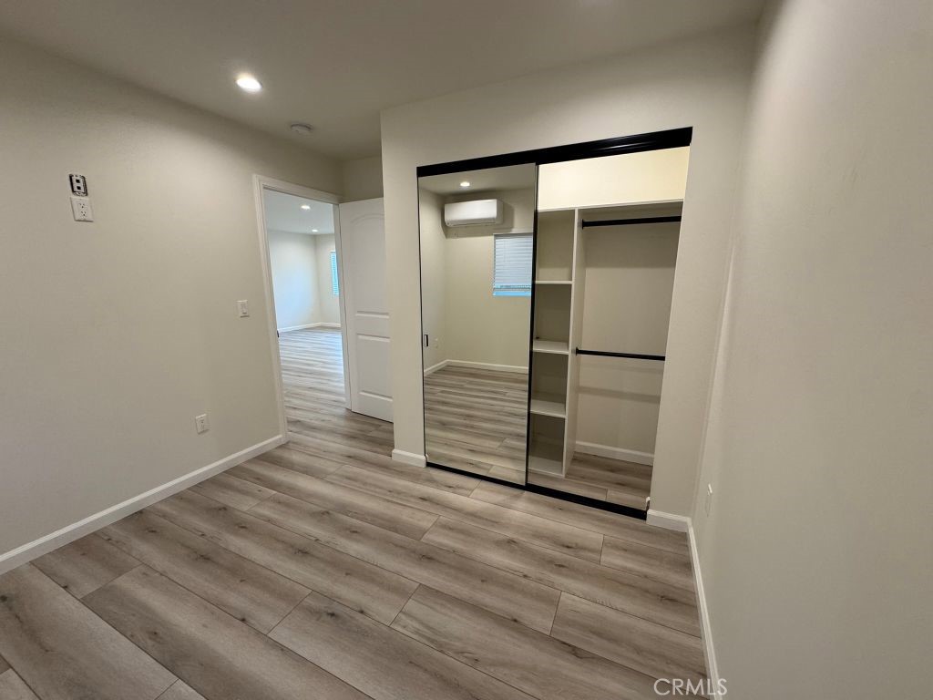 7149 Apperson Street, Unit 2 Tujunga, CA 91042 - Photo 9 of 12 a view of wooden floor and windows in a room