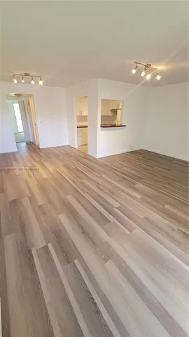 a view of a bedroom with a bathroom