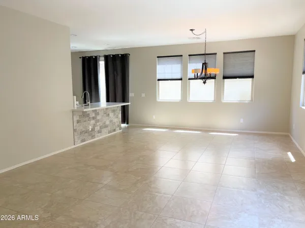 a view of a kitchen with a sink and window