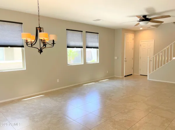 a view of a room with wooden floor and windows