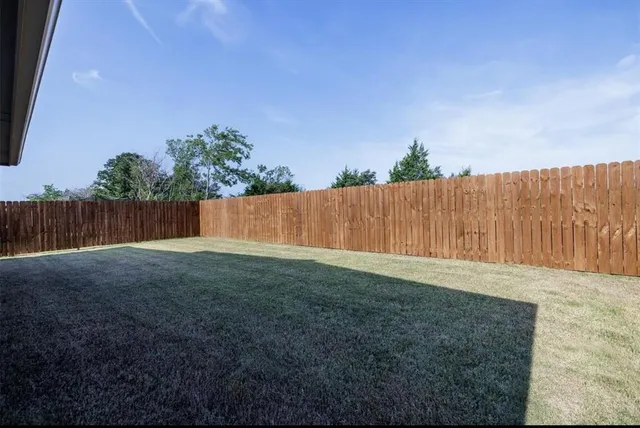 a view of backyard with green space