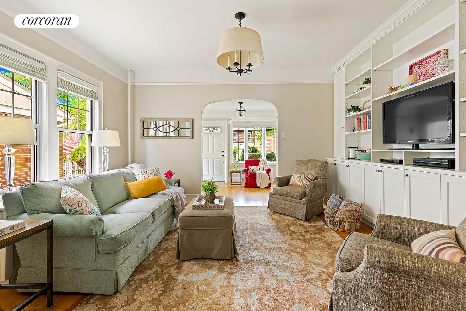 7709 Colonial Road Brooklyn, NY 11209 - Photo 2 of 13 a living room with furniture and a flat screen tv